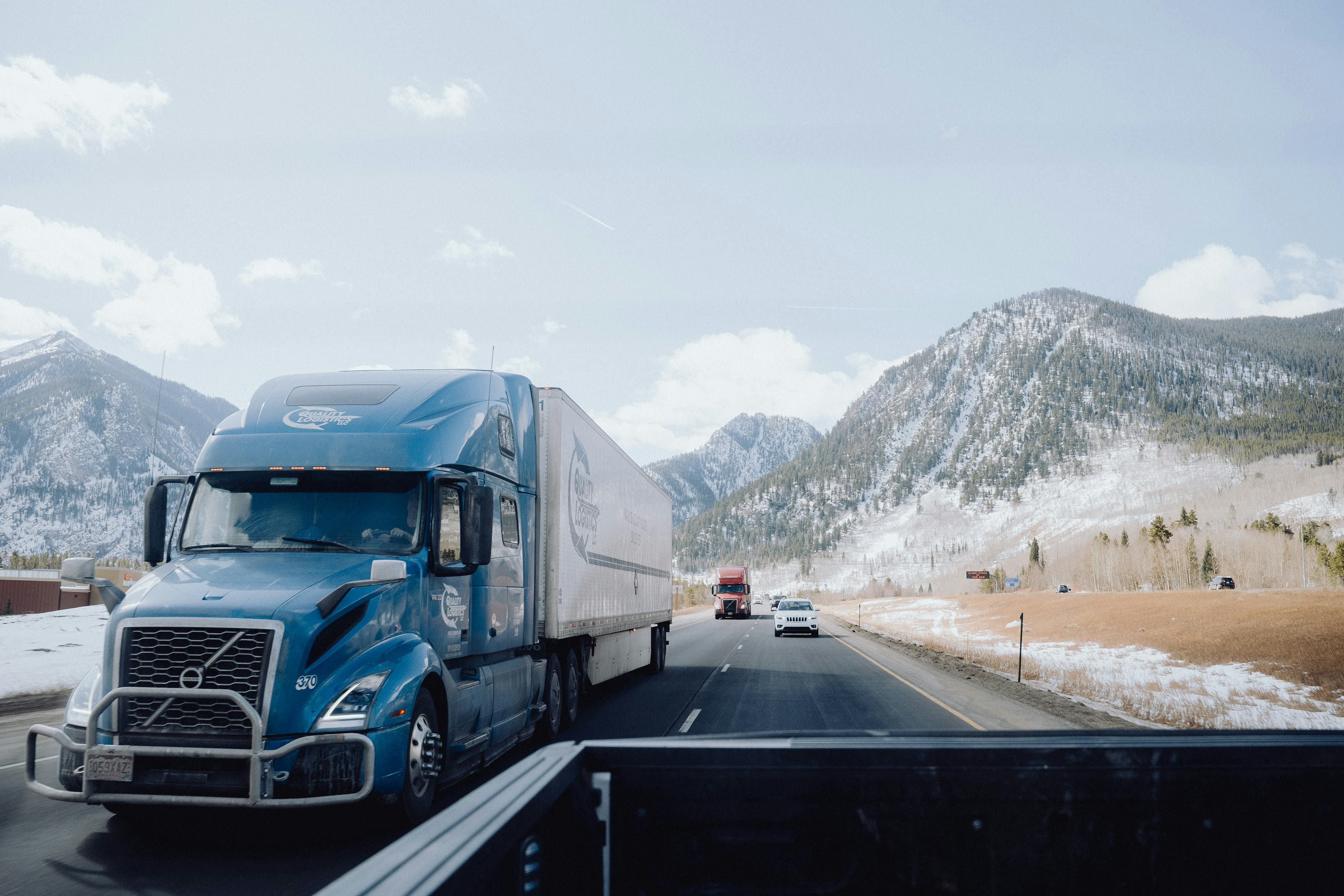 A semi truck hauling freight on a highway